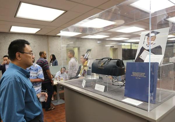 Libary visitor looking at exhibit celebrating the AAPI community